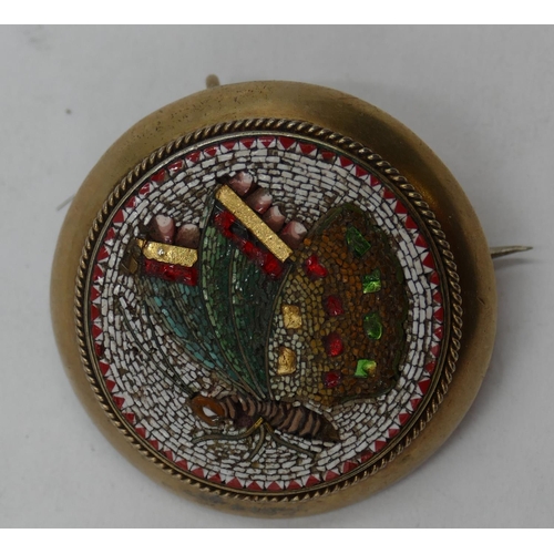 444 - A circular micro mosaic brooch depicting winged insect, 3.5cm diameter.