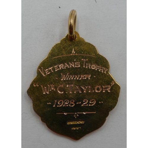 446 - A 15ct gold Cathkin Braes Golf Club medal, Veterans Trophy Winner 1928-29 with part blue enamelled d... 