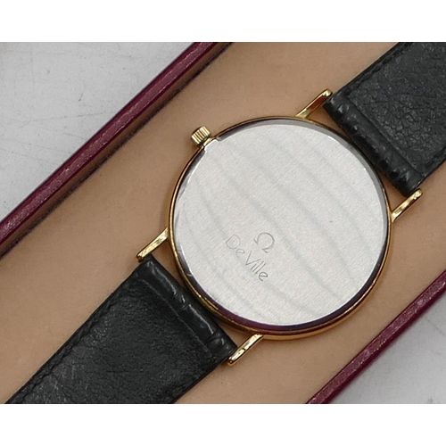 447 - A gentleman's Omega De Ville circular wrist watch with leather strap, with original guarantee and bo... 