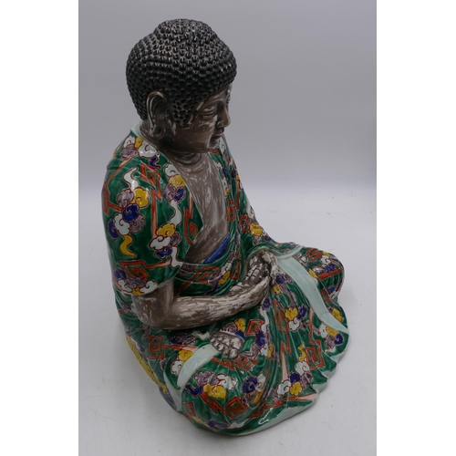 48 - A 19th/early 20th Century Chinese figure of a seated Buddha on silvered ground with multi-coloured c... 