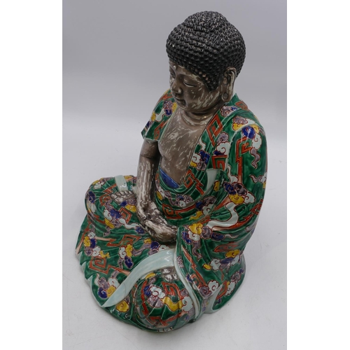 48 - A 19th/early 20th Century Chinese figure of a seated Buddha on silvered ground with multi-coloured c... 