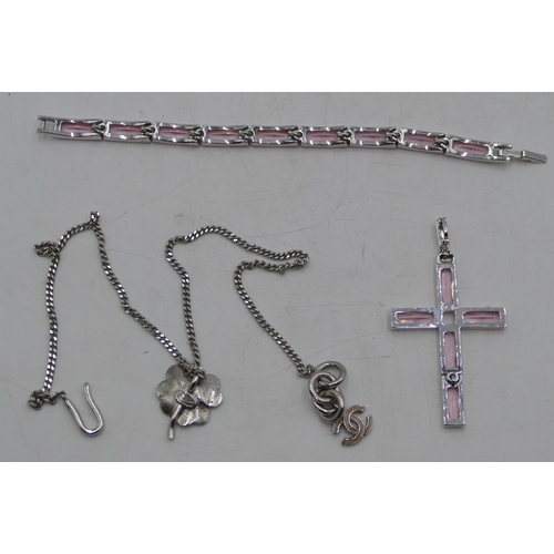 494 - A Swarovski panel bracelet with clear stones, a similar cross pendant and a Channel style pendant wi... 