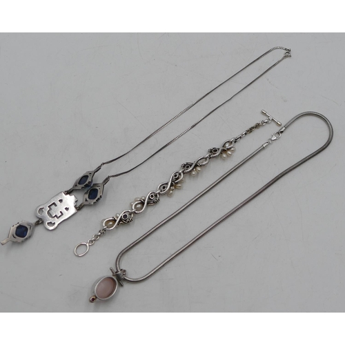 495 - A silver drop pendant set with cut steel and chain, a silver pendant on chain, a silver bracelet wit... 