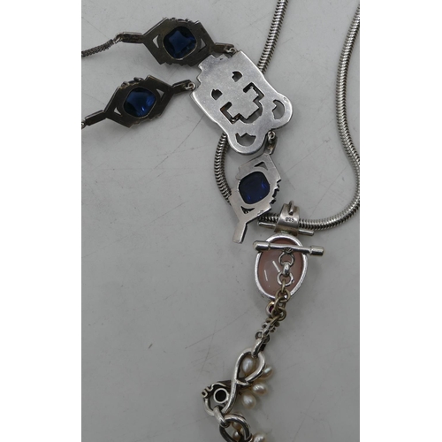 495 - A silver drop pendant set with cut steel and chain, a silver pendant on chain, a silver bracelet wit... 