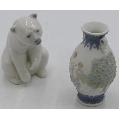 5 - A Lladro figure of a seated polar bear, 7.5cm high, a small Lladro bulbous thin necked,2 -handled va... 