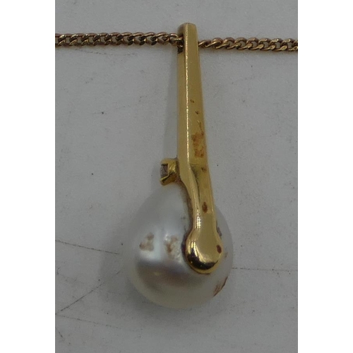 503 - A gold drop pendant mounted with cultured pearl and small diamond and 9ct gold chain, 4.1 gram gross... 