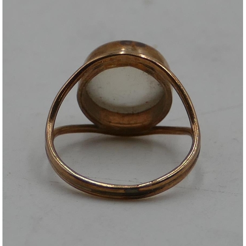 506 - A 9ct gold ring set with moonstone, with open shoulders, size K.