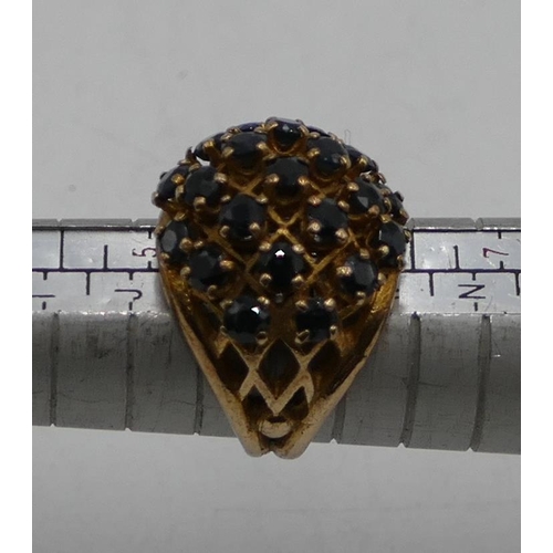 507 - A 9ct gold large cluster ring with pierced decoration and mounted with various sapphires, size L/M, ... 