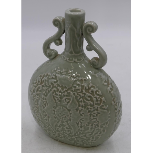 51 - An Oriental bulbous thin necked two-handled bottle vase on pale green ground with raised bat and scr... 