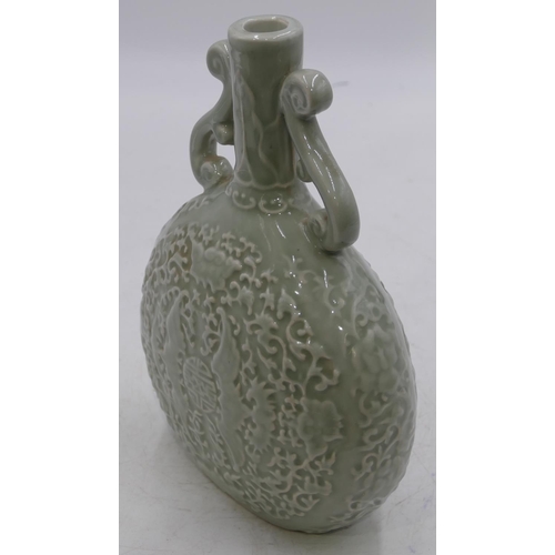 51 - An Oriental bulbous thin necked two-handled bottle vase on pale green ground with raised bat and scr... 