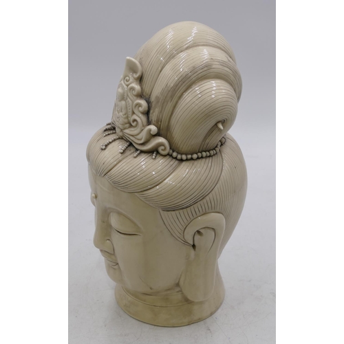 52 - An Oriental blanc-de-chine figurehead of a lady, 32cm high.