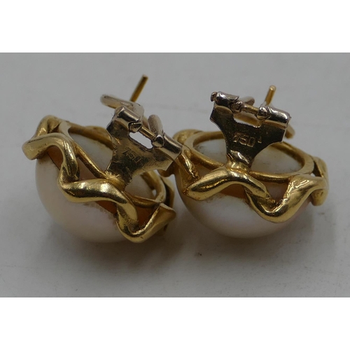 520 - A pair of 18ct gold pearl earrings with scallop shaped rims, each set with solitaire diamond, 1.6cm ... 