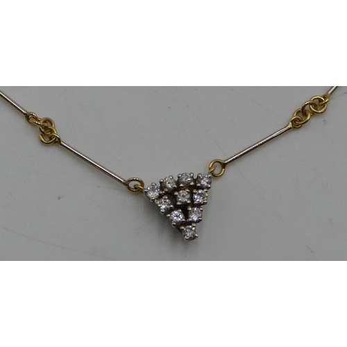 522 - An 18ct gold triangular shaped pendant inset with 10 diamonds on 18ct gold linked and bar chain, 40c... 