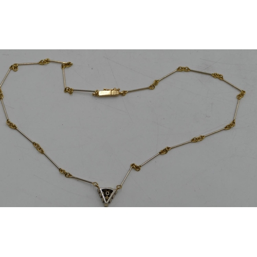 522 - An 18ct gold triangular shaped pendant inset with 10 diamonds on 18ct gold linked and bar chain, 40c... 