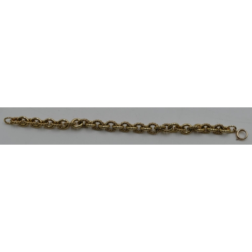 523 - An 18ct gold engraved and plain linked bracelet with later 14ct gold clip, 20cm long, 41.4 grams gro... 