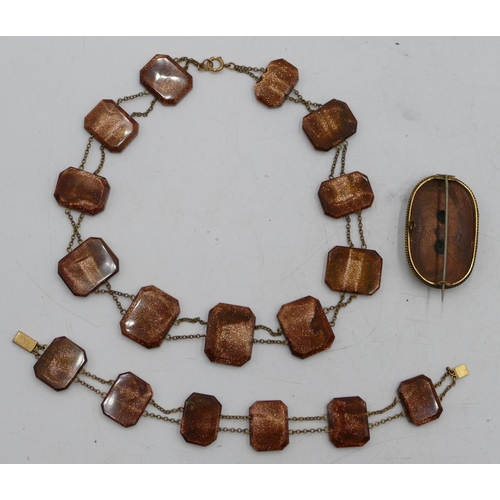 534 - A Victorian Goldstone necklace with matching bracelet and similar brooch. (3)