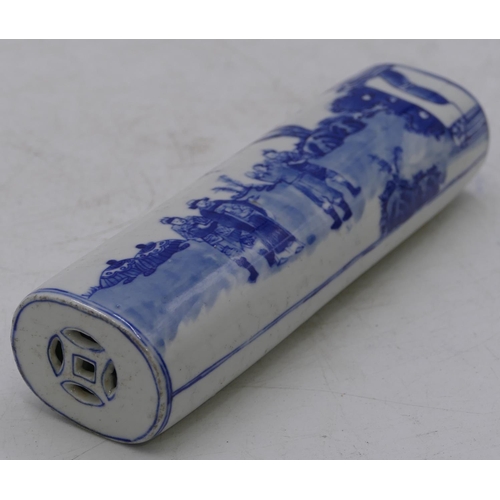 54 - An Oriental oblong blue and white scroll weight with figure decoration, 16cm long.