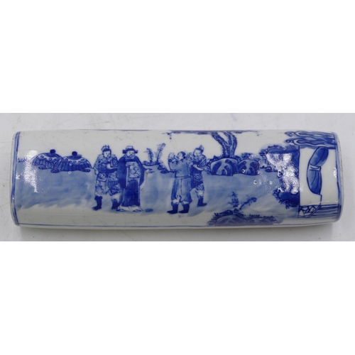 54 - An Oriental oblong blue and white scroll weight with figure decoration, 16cm long.