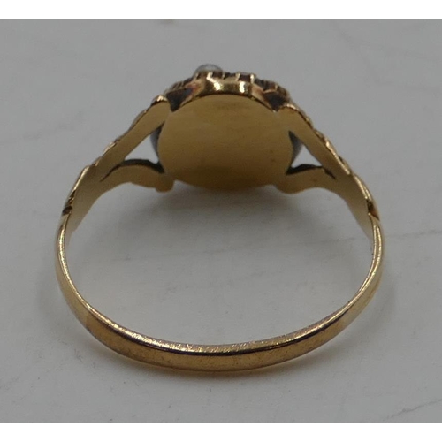 540 - A Victorian gold ladies' cluster ring set with centre pink stone surrounded by half pearls (2 pearls... 