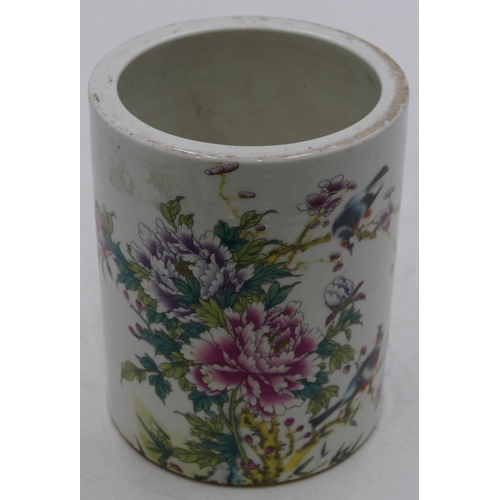 55 - An Oriental cylindrical brush pot on white ground with multi-coloured bird, branch and floral decora... 