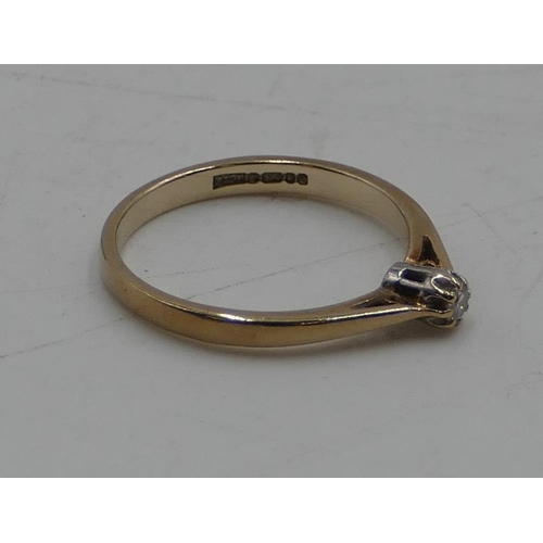 551 - A 9ct gold small solitaire diamond ring, size P/Q, 2 grams gross.