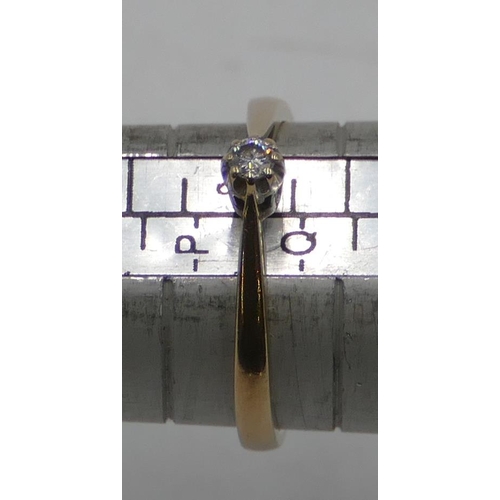 551 - A 9ct gold small solitaire diamond ring, size P/Q, 2 grams gross.