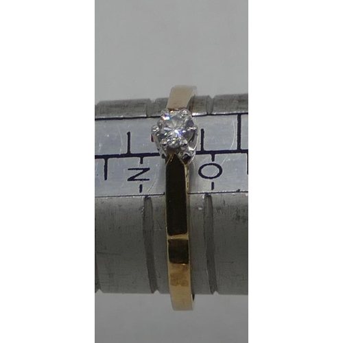 553 - A 9ct gold solitaire diamond ring, size N/O.