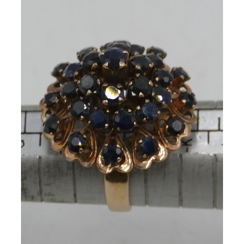 554 - A high carat gold waterfall ring set with 31 sapphires, size I/J, 6.8 grams gross.