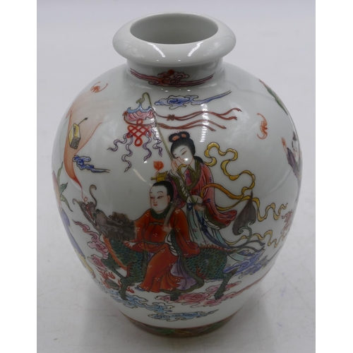 56 - An Oriental round bulbous thin necked vase on white ground with multi-coloured figure and animal dec... 