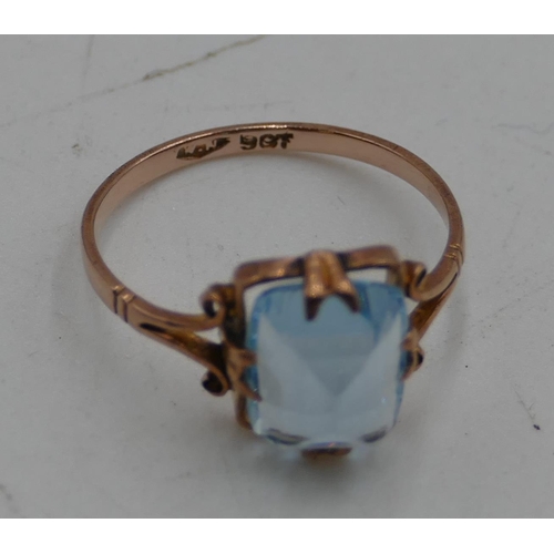 563 - A 9ct gold ladies' ring set with pale blue stone, size L.