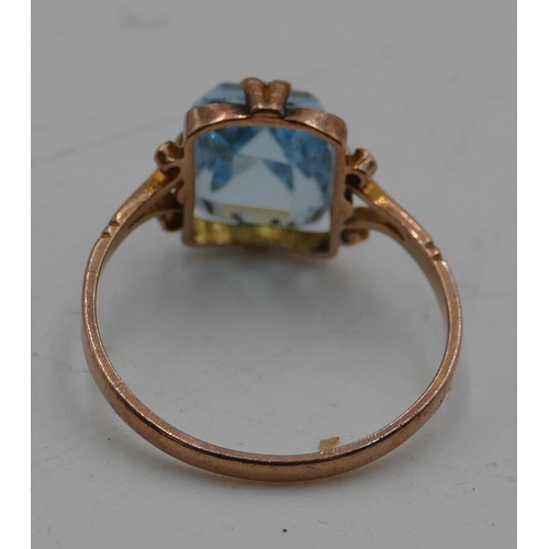 563 - A 9ct gold ladies' ring set with pale blue stone, size L.