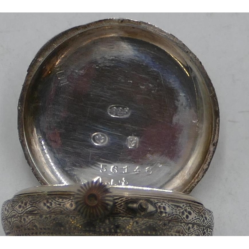 575 - A 925 silver fob watch with white enamel dial. allover chased decoration, a silver circular brooch w... 