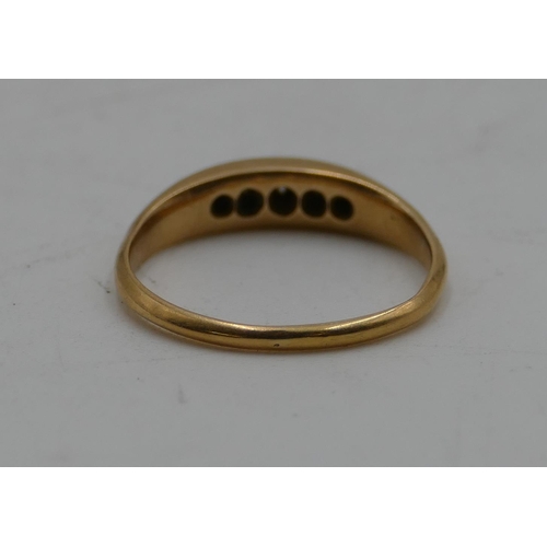 587 - An 18ct gold boat shaped ring set with 5 small diamonds, size N, 3.1 grams gross.