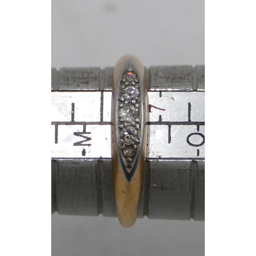 587 - An 18ct gold boat shaped ring set with 5 small diamonds, size N, 3.1 grams gross.