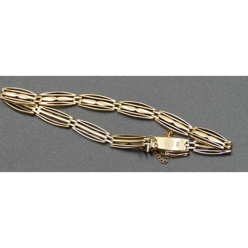 598 - A 14ct gold oval pierced bracelet with safety chain, 13.4 grams.