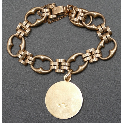 599 - A 9ct gold oval bracelet with guard chain, 16 grams also mounted with 18ct gold pendant, 5.5 grams, ... 