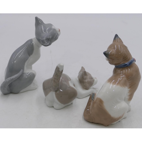 6 - 2 Lladro figures of seated and prowling cat, largest 14cm high and a Nao seated cat. 13cm high (3)