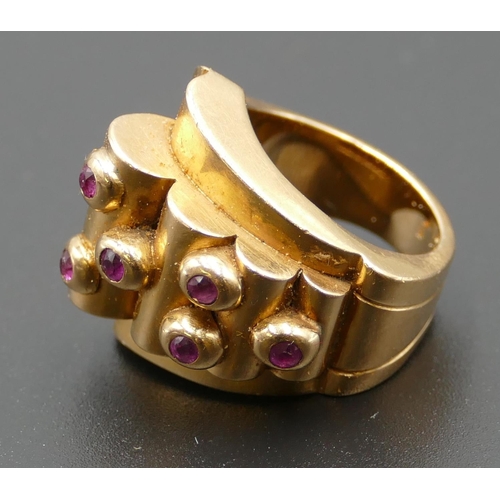 618 - A Continental gold coloured metal ladies' ring set with 6 raised rubies, size M, 17.2 grams.