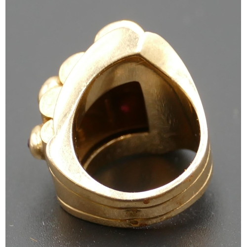 618 - A Continental gold coloured metal ladies' ring set with 6 raised rubies, size M, 17.2 grams.