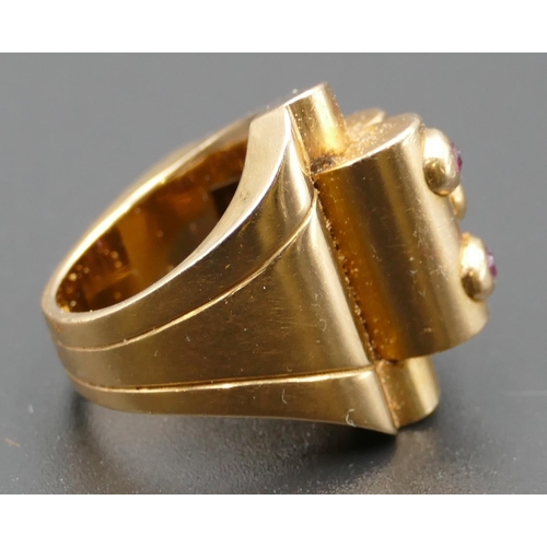 618 - A Continental gold coloured metal ladies' ring set with 6 raised rubies, size M, 17.2 grams.