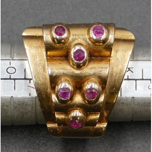 618 - A Continental gold coloured metal ladies' ring set with 6 raised rubies, size M, 17.2 grams.