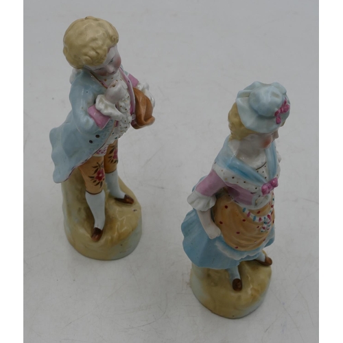 62 - A pair of Bisque china figures of young gentleman and lady, on blue and pink ground, 22cm high.