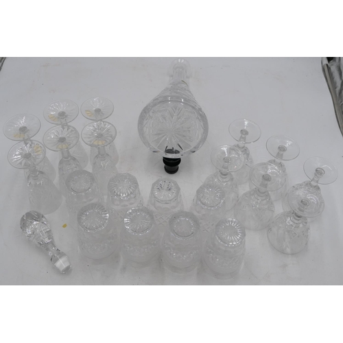 65 - A set of 8 cut glass tumblers with tooth cut decoration, 6 other wine glasses and a cut glass decant... 