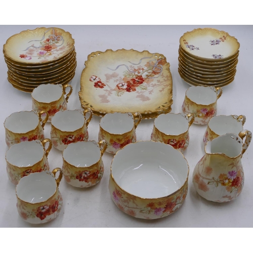 69 - M Redon Limoges service on cream and yellow ground with multi-coloured floral, leaf and gilt decorat... 