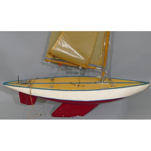 722 - A pond yacht with sails 75cm long, 1 meter 30cm high overall.