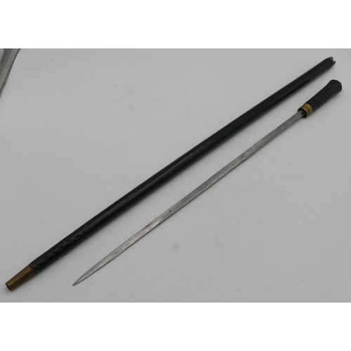 728 - An ebonised sword stick with gilt metal mounts, 91cm long overall.