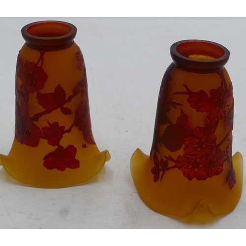 73 - A pair of reproduction galle style trumpet shaped light shades on yellow ground with raised red leaf... 