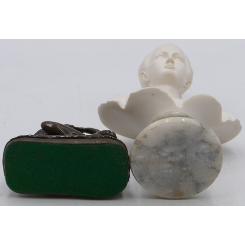 731 - A composition bust of a lady on round onyx base, 26cm high and a composition erotic group, 12.5cm wi... 