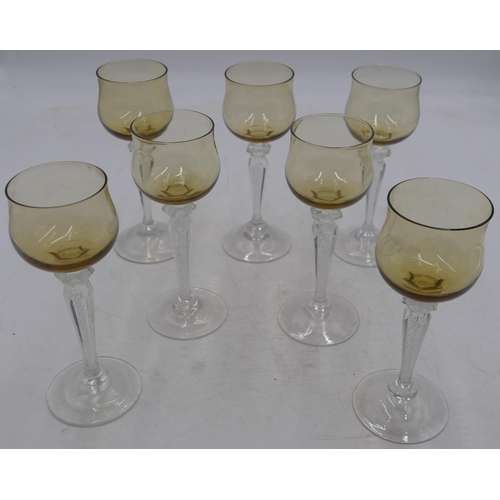 77 - A set of 7 hock glasses with amber coloured bowls on clear hexagonal stems and round bases, 18cm hig... 