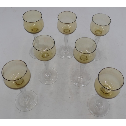 77 - A set of 7 hock glasses with amber coloured bowls on clear hexagonal stems and round bases, 18cm hig... 